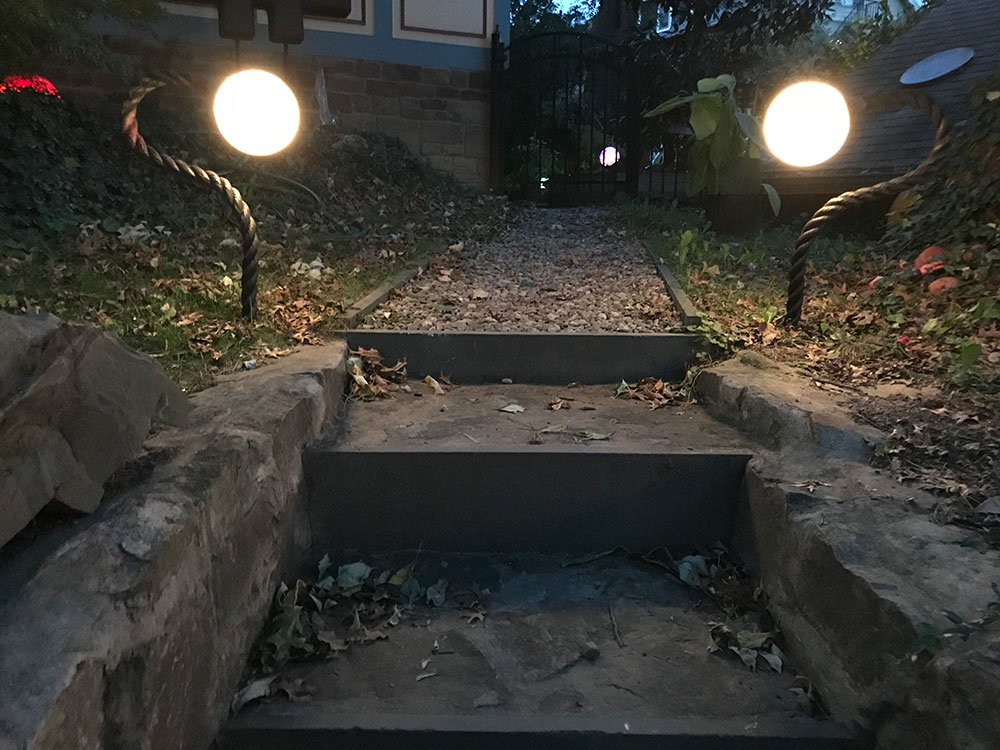 Two 8” White nightorbs with rope extensions provide lighting to steps