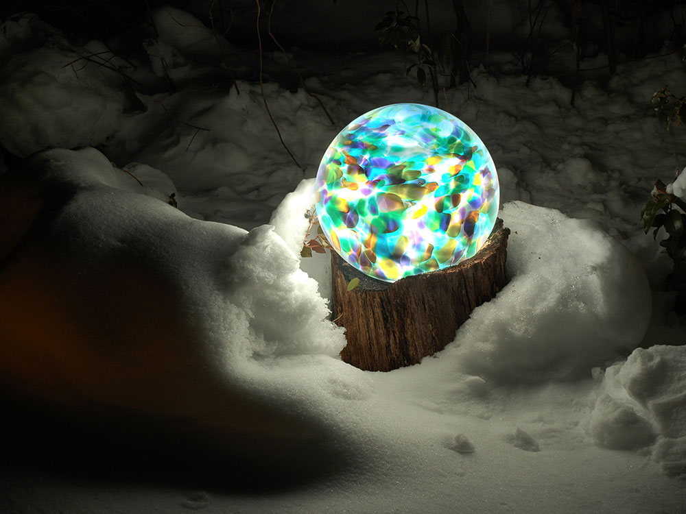 13" Jupiter color pattern orb on wood stump in the snow