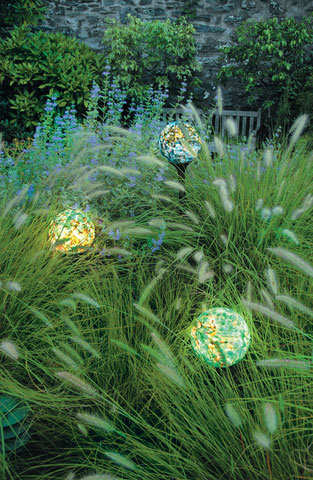 Three Earth color pattern nightorbs provide colored lighting in tall grass