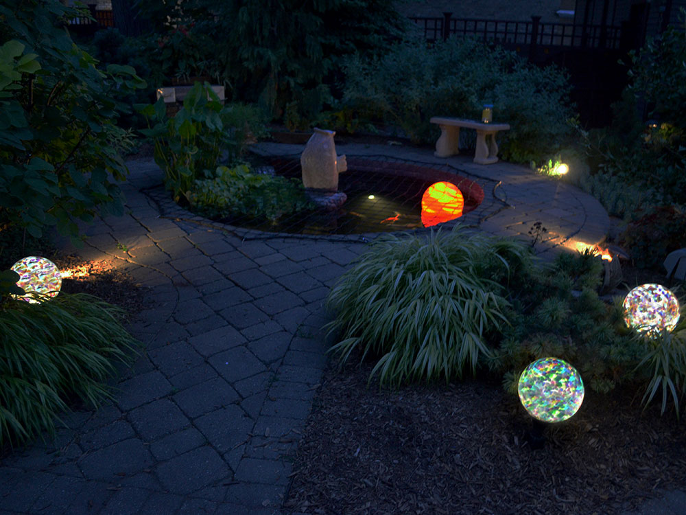 Three nightorbs around water feature with 13 inch Orb for pond lighting