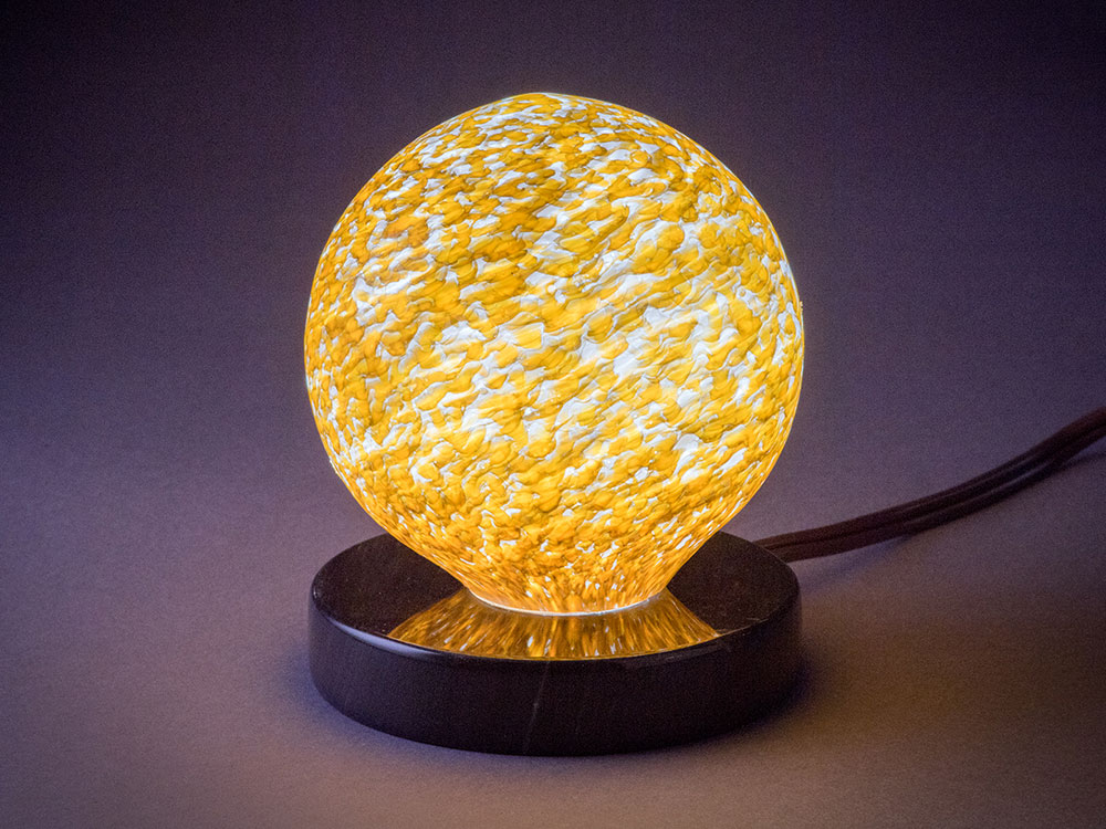 Four inch Gold dimmable Interior Orb on polished marble base mood lighting