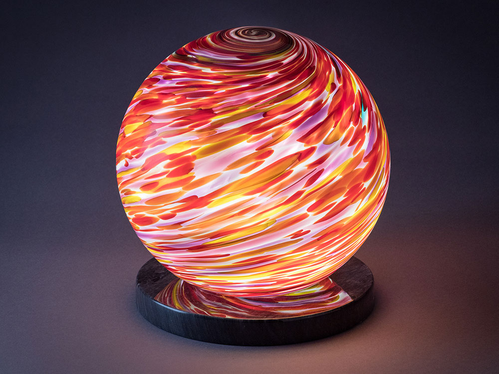 Eight inch Phobos dimmable Interior Orb on polished marble base artistic lighting