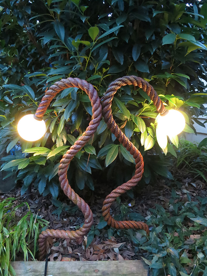 A pair of Four inch orblet rope fixtures create an artistic lighting touch