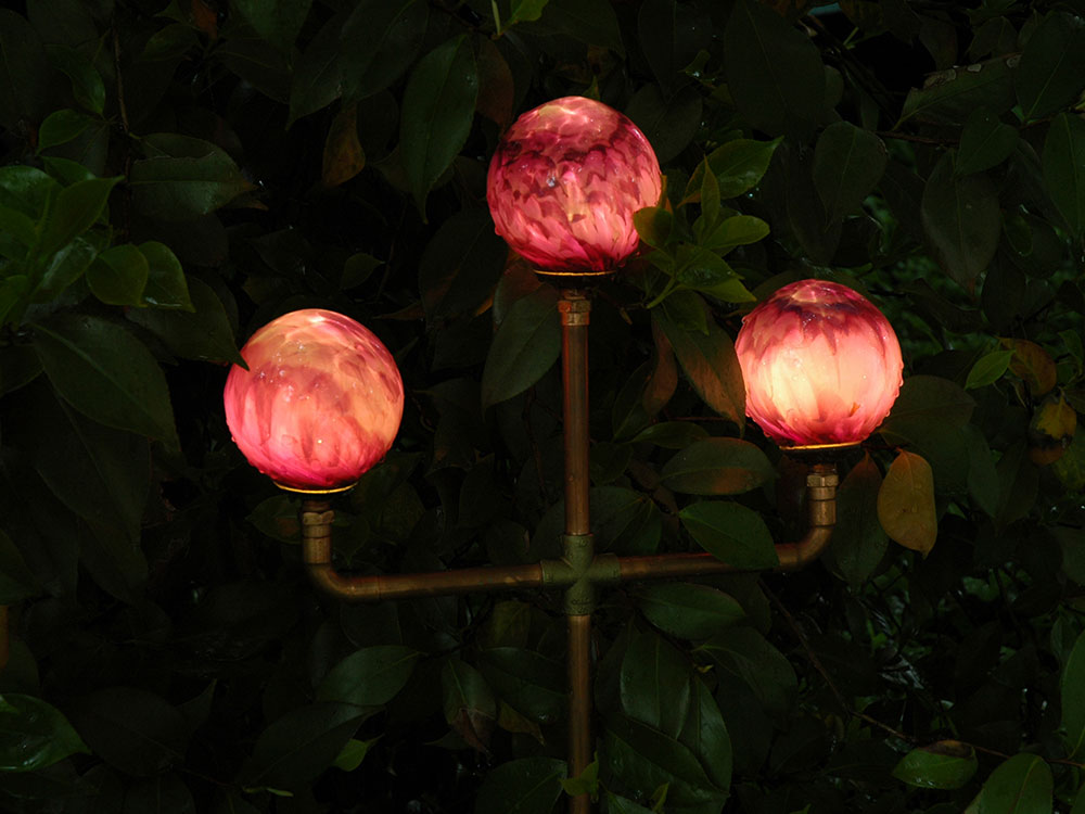 Three Orblet copper stem luminaire