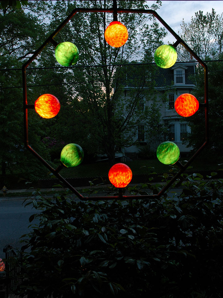 Eight Red and Green Orblet copper stem welcome wreath lighting luminaire